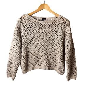beige open-knit pullover sweater featuring textured crochet pattern long sleeves